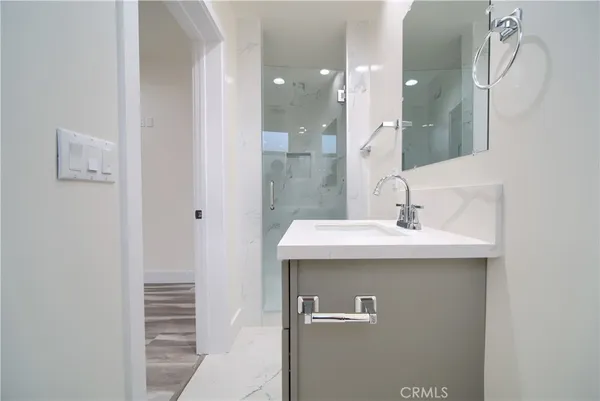 a bathroom with a sink and a mirror