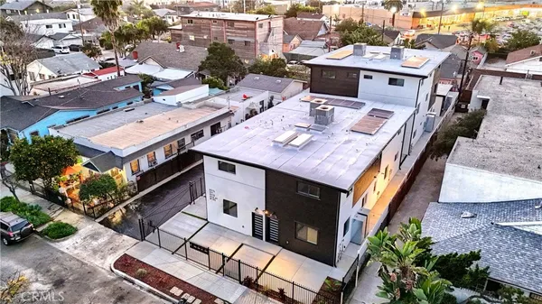 an aerial view of a house with a big yard