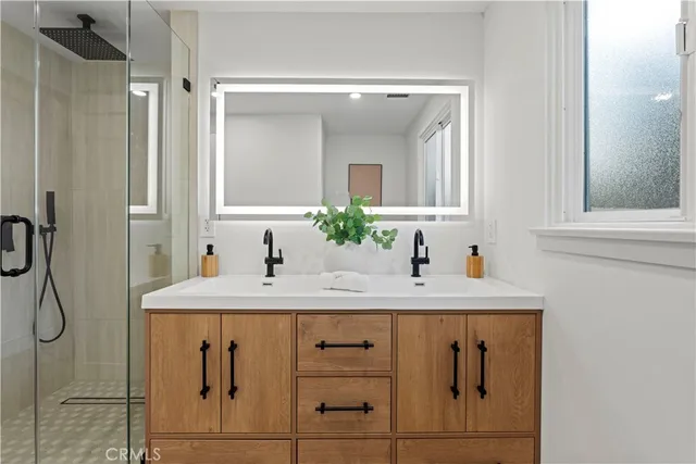 a bathroom with a sink and a mirror