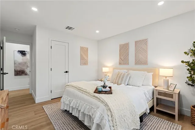 a bedroom with a bed and a walk in closet