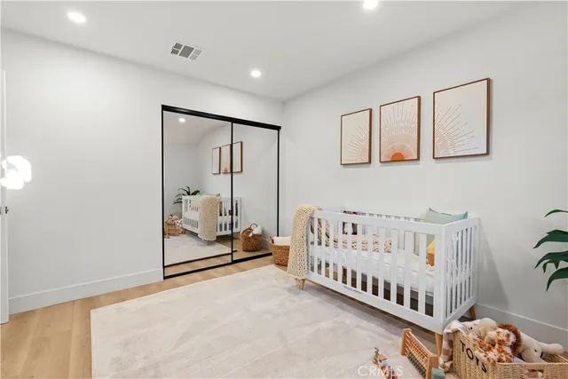 a bedroom with furniture and a large window