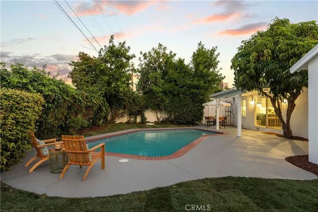 a view of a swimming pool with a yard