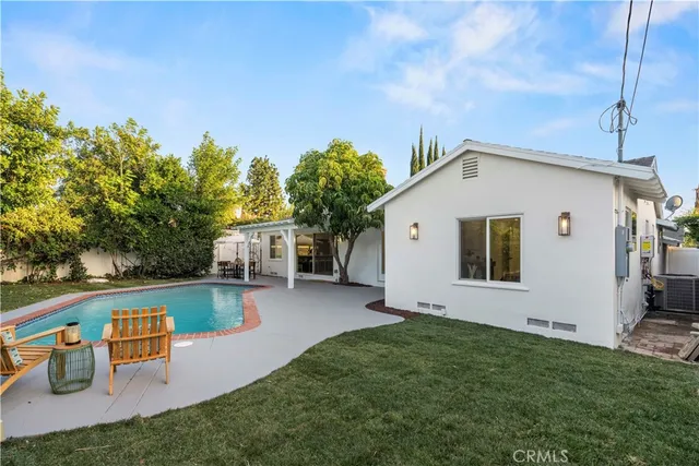 an outdoor space with furniture and umbrella