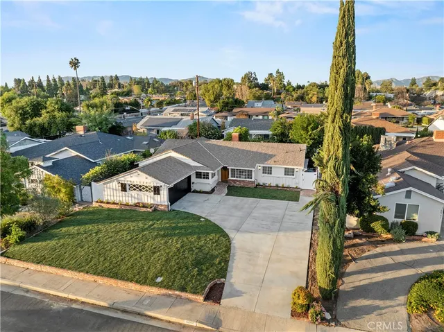 an aerial view of a house with outdoor space