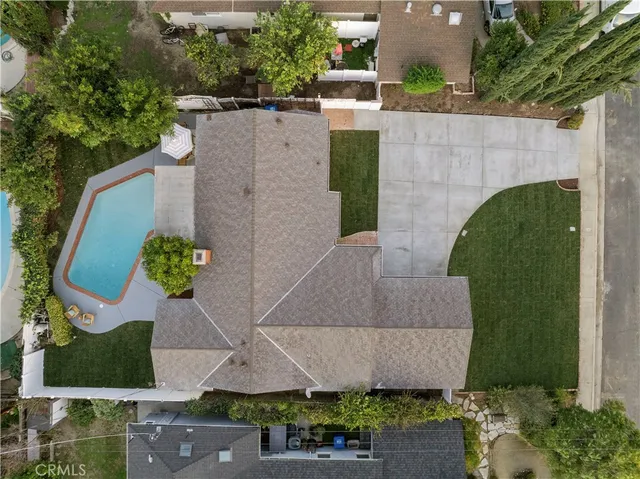 an aerial view of multiple houses with yard