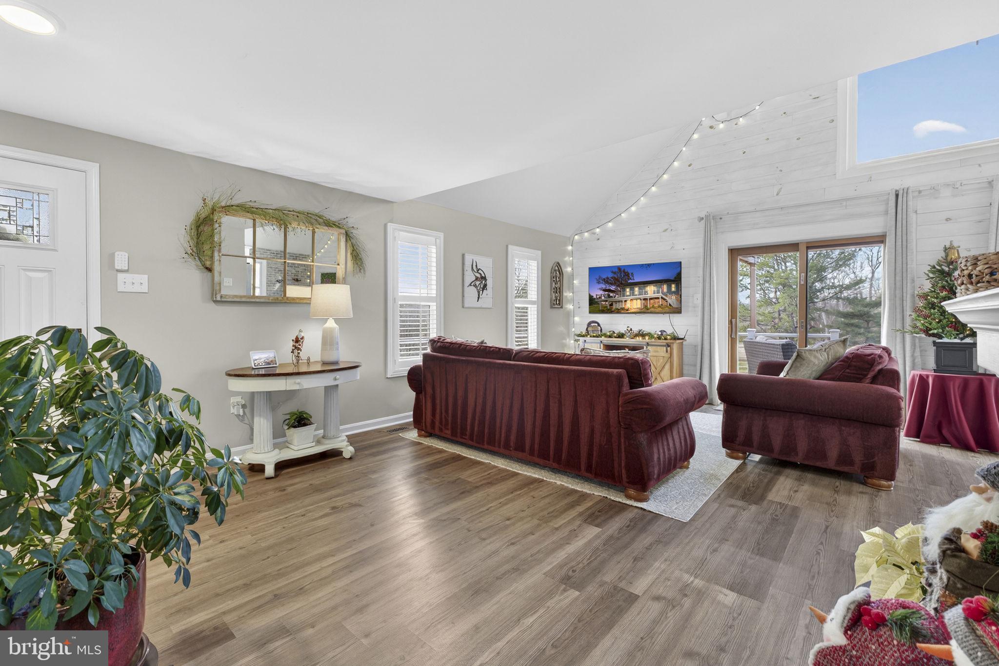 9666 Springs Road Warrenton, VA 20186 - Photo 15 of 77 a living room with furniture and a wooden floor