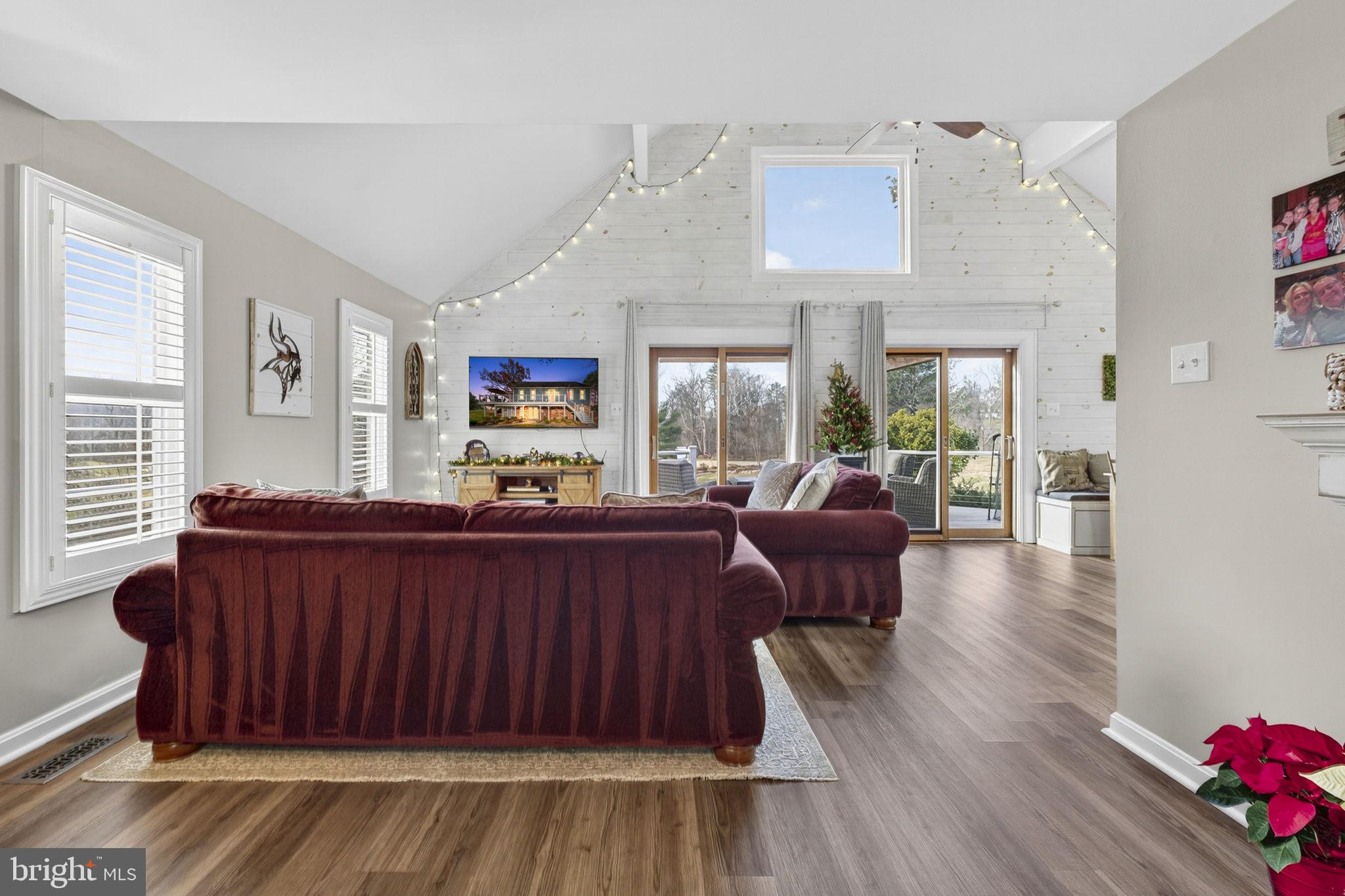 9666 Springs Road Warrenton, VA 20186 - Photo 16 of 77 a living room with furniture and a wooden floor