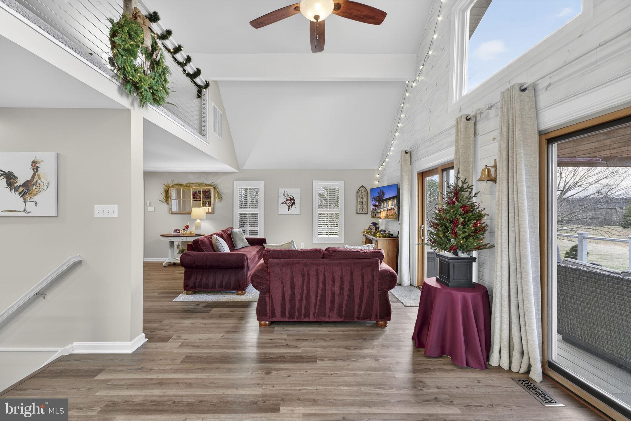 9666 Springs Road Warrenton, VA 20186 - Photo 20 of 77 a living room with furniture and a fireplace
