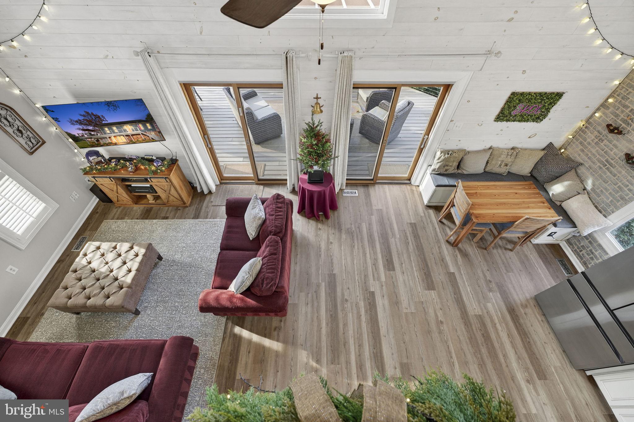 9666 Springs Road Warrenton, VA 20186 - Photo 39 of 77 a living room with furniture and wooden floor