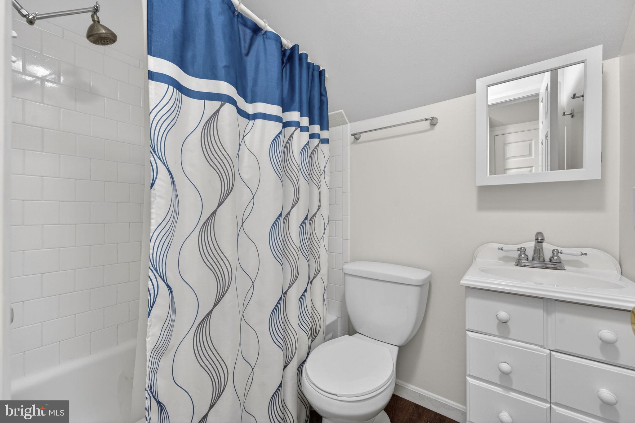 9666 Springs Road Warrenton, VA 20186 - Photo 41 of 77 a bathroom with a toilet sink and mirror