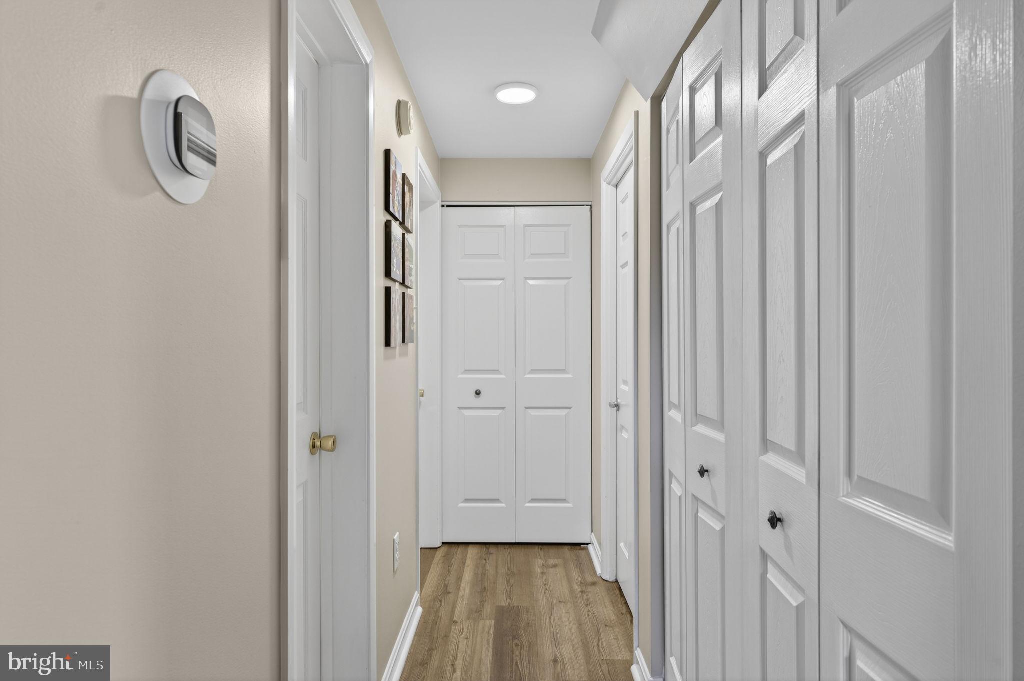 9666 Springs Road Warrenton, VA 20186 - Photo 42 of 77 a view of a hallway with wooden floor