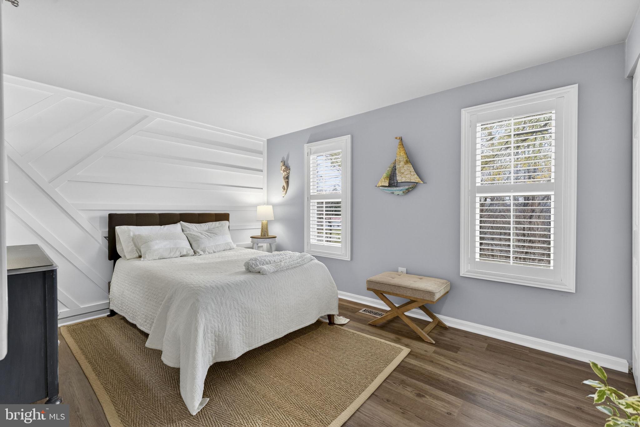 9666 Springs Road Warrenton, VA 20186 - Photo 45 of 77 a bedroom with a bed and wooden floor