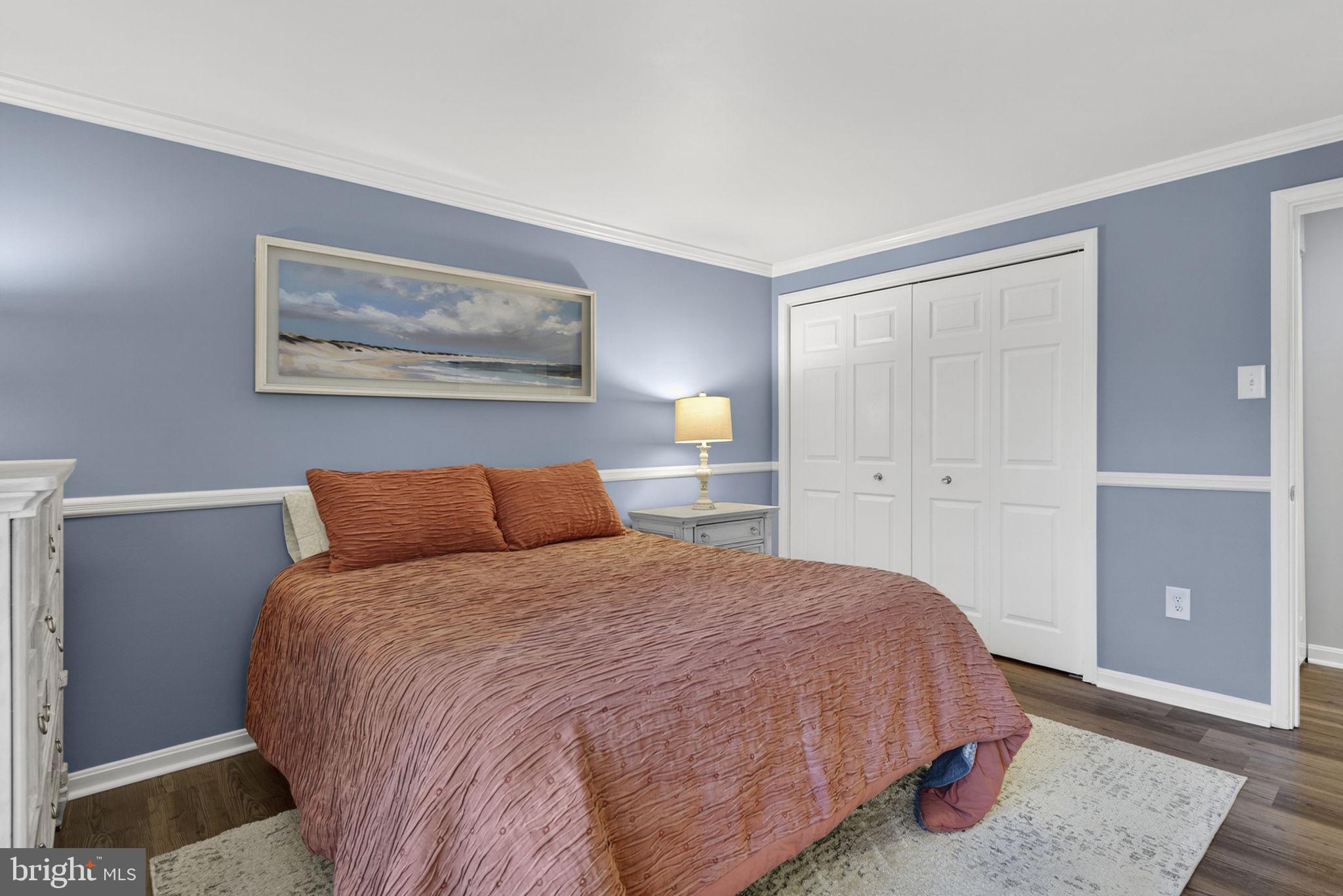 9666 Springs Road Warrenton, VA 20186 - Photo 49 of 77 a bedroom with a bed and painting on the wall
