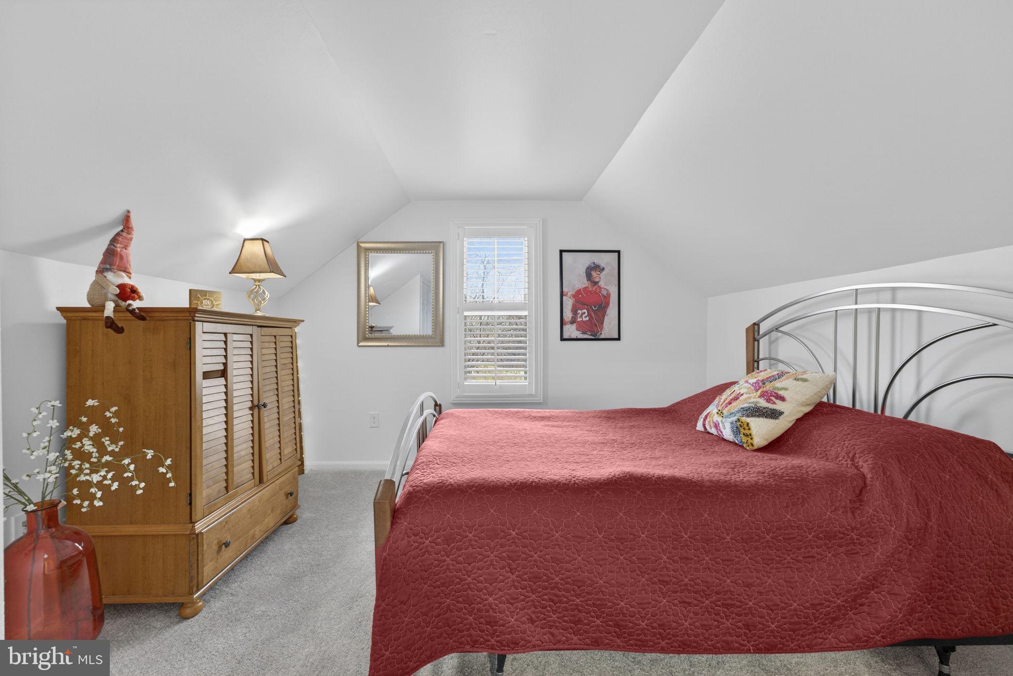 9666 Springs Road Warrenton, VA 20186 - Photo 52 of 77 a bedroom with a bed and wooden floor