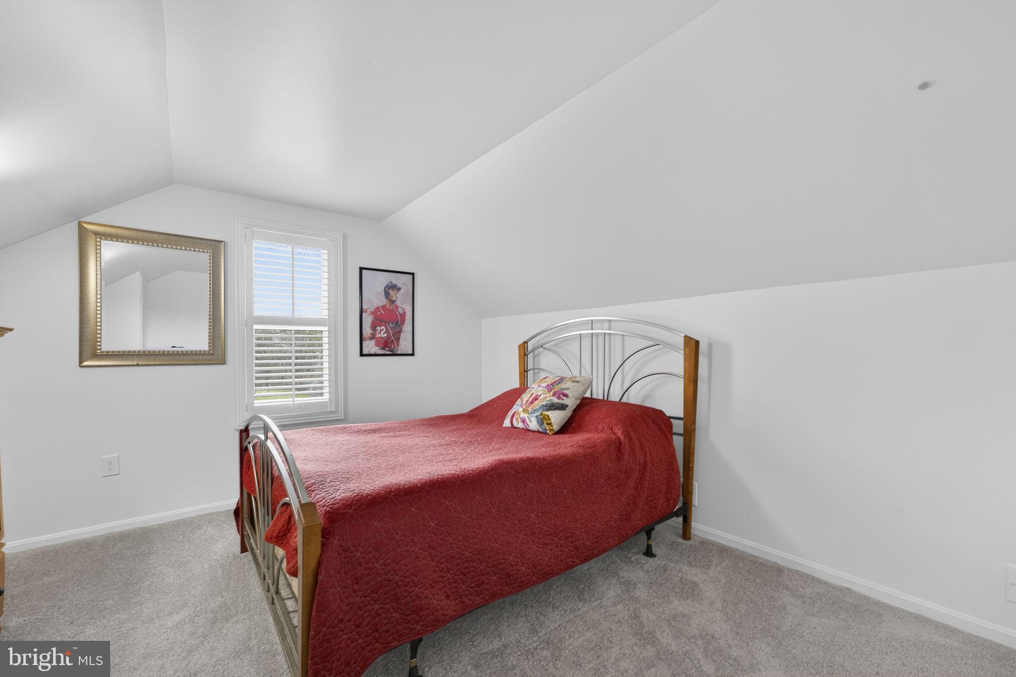 9666 Springs Road Warrenton, VA 20186 - Photo 53 of 77 a bedroom with a bed and a lamp with window