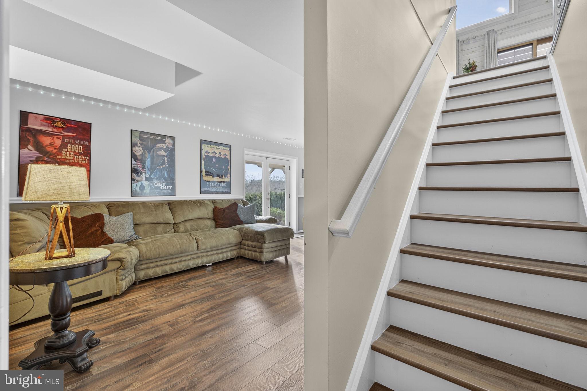 9666 Springs Road Warrenton, VA 20186 - Photo 56 of 77 a living room with furniture and a wooden floor