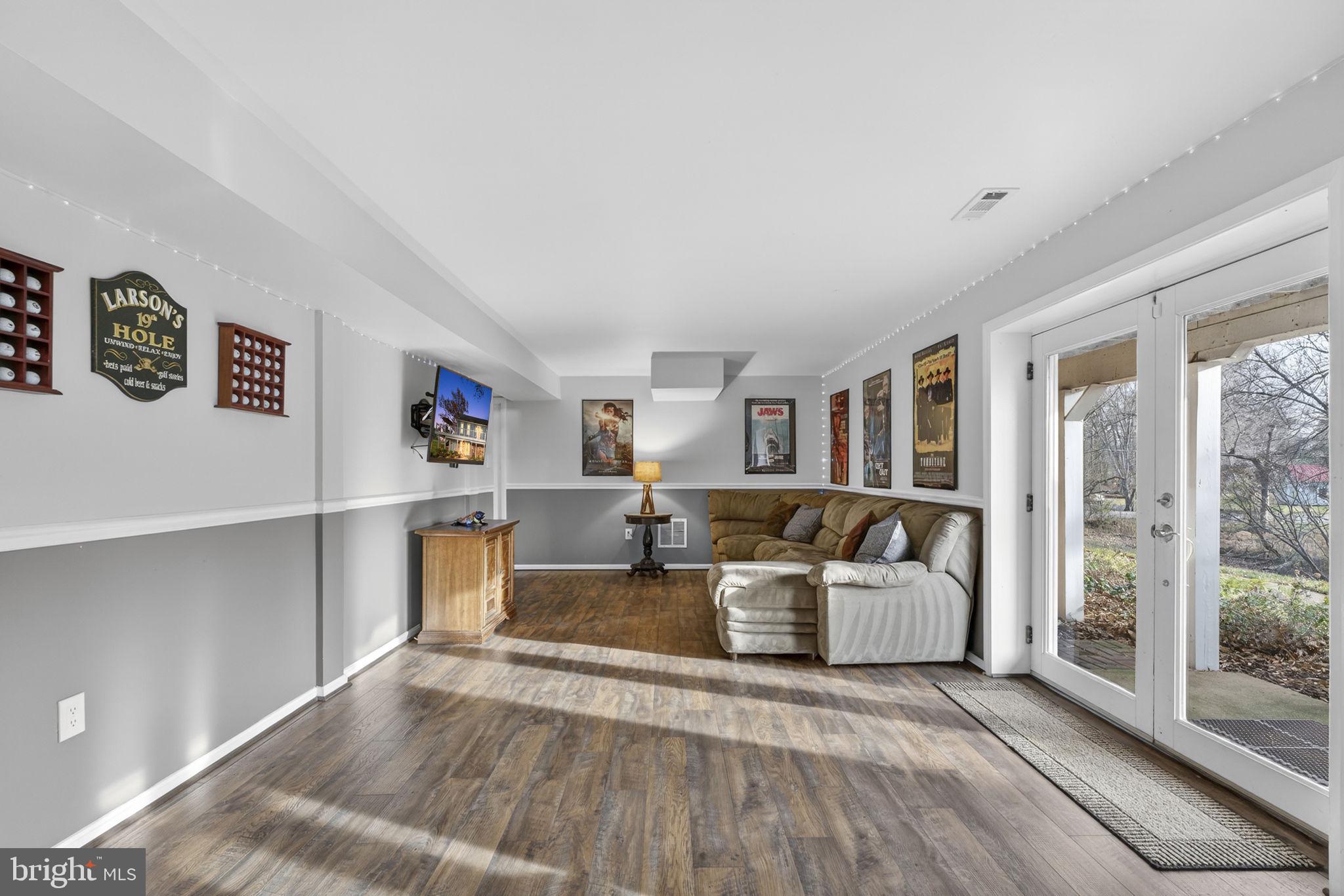 9666 Springs Road Warrenton, VA 20186 - Photo 60 of 77 a living room with furniture and a large window