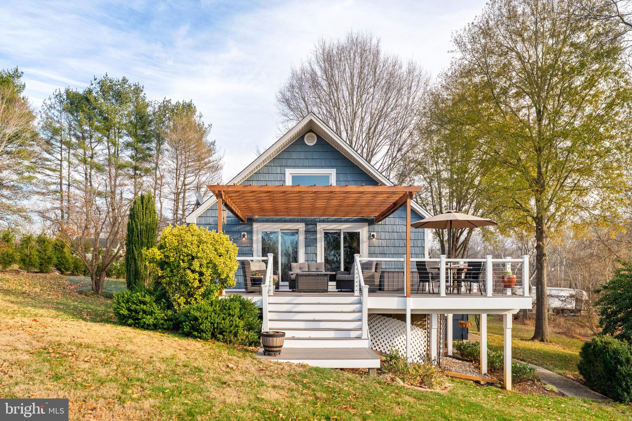 9666 Springs Road Warrenton, VA 20186 - Photo 62 of 77 a front view of a house with a yard