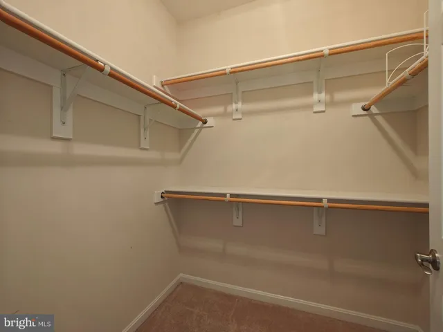 a living room with furniture a rug and a large window