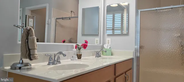 a living room with furniture and large windows