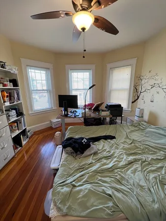 a bed room with a bed and a chandelier