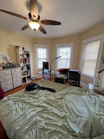 a bed room with a bed and a chandelier
