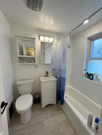 a bathroom with a toilet sink and bathtub