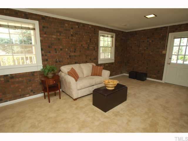 731 Davidson Street Raleigh, NC 27609 - Photo 8 of 10 Family room has new carpet and new paint. Great room for gathering around for the big game or letting the kids run wild