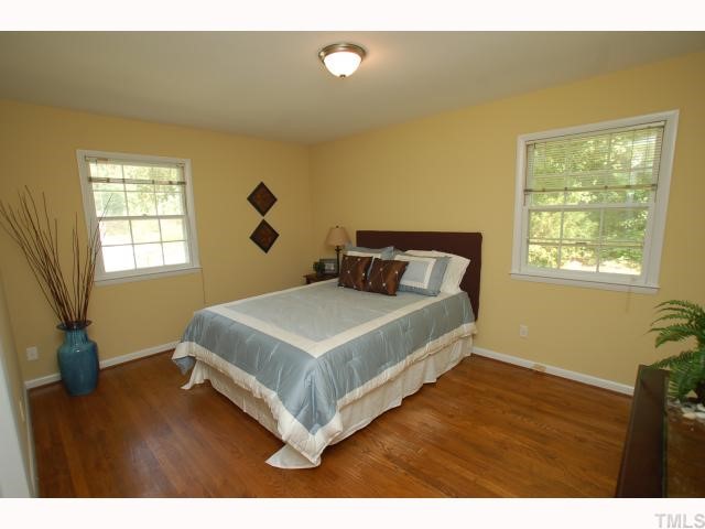 731 Davidson Street Raleigh, NC 27609 - Photo 9 of 10 Master bedroom has hardwood floors, new paint and new light fixture