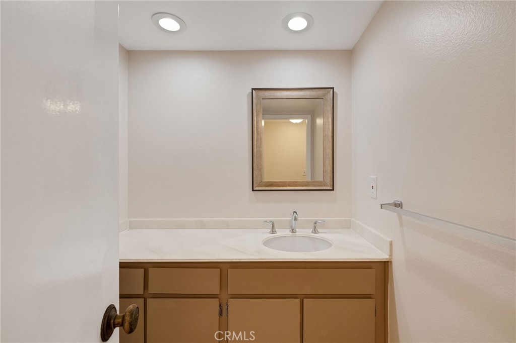 28003 Ridgebrook Court Rancho Palos Verdes, CA 90275 - Photo 11 of 25 a bathroom with a sink a toilet and mirror