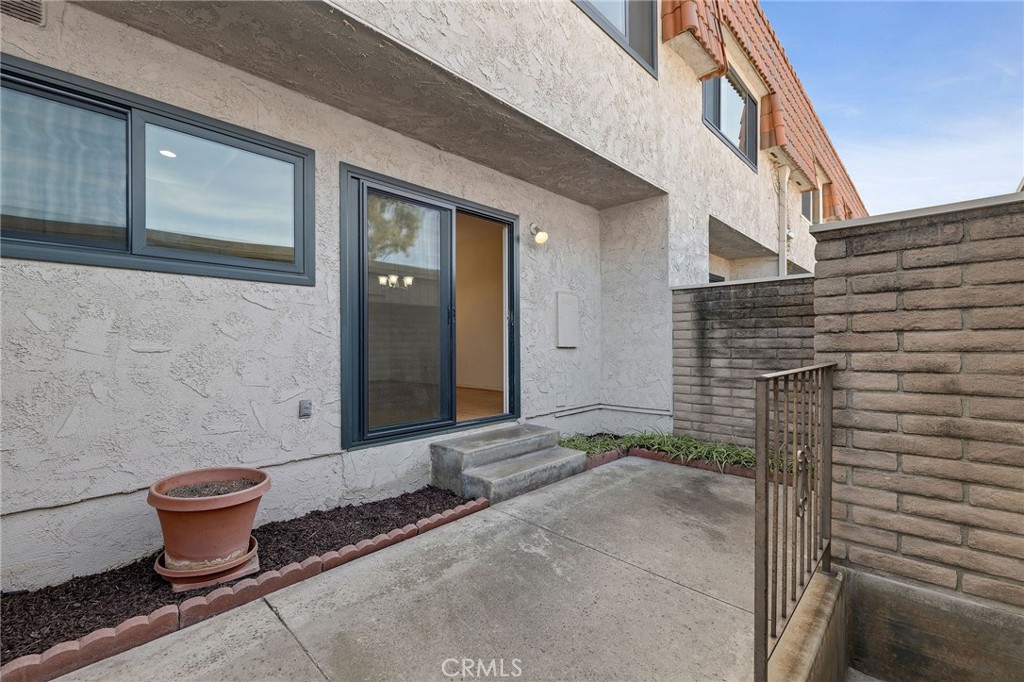 28003 Ridgebrook Court Rancho Palos Verdes, CA 90275 - Photo 20 of 25 a brick house with potted plants in front of it