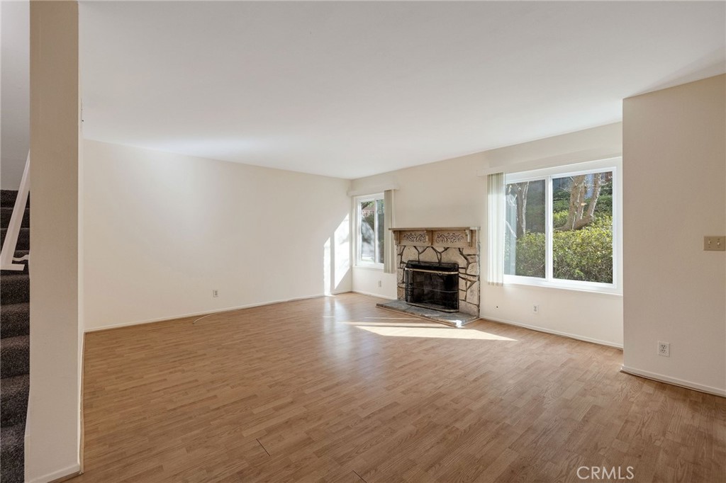 28003 Ridgebrook Court Rancho Palos Verdes, CA 90275 - Photo 4 of 25 an empty room with furniture and a fireplace