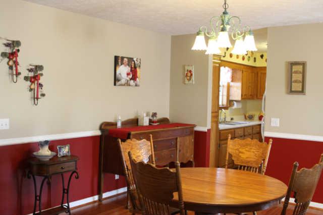 101 Maple Street Adams, TN 37010 - Photo 4 of 15 The dining area is spacious and is conveniently located just off the kitchen. The covered deck is just steps away. Perfect for grilling.