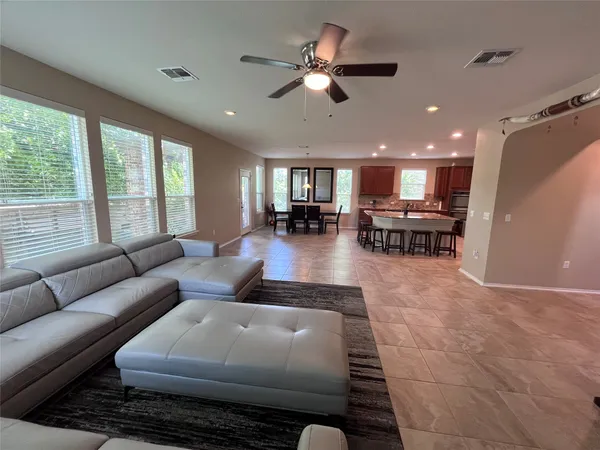 a living room with furniture and a large window