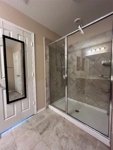 a white toilet sitting next to a white sink