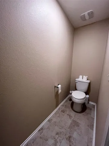 a bathroom with a shower sink and mirror