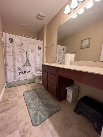 a view of a room with gym equipment and a window