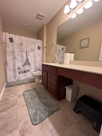 a view of a room with gym equipment and a window