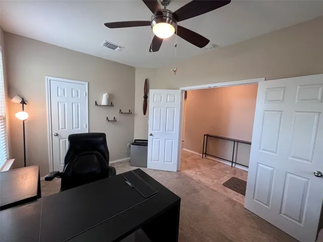 a view of a livingroom with furniture and entryway