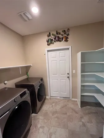 a utility room with cabinets