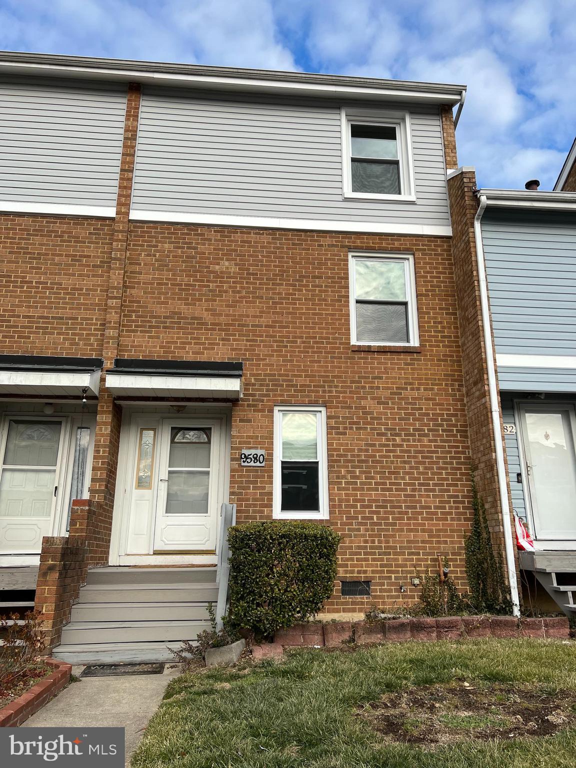 9580 Canterbury Riding, Unit 210 Laurel, MD 20723 - Photo 1 of 10 a front view of a house with a yard