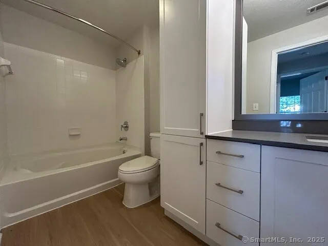 a bathroom with a toilet a sink and bathtub