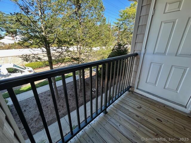 138 Hollow Tree Ridge Road, Unit 121 Darien, CT 06820 - Photo 20 of 26 a view of balcony with wooden floor