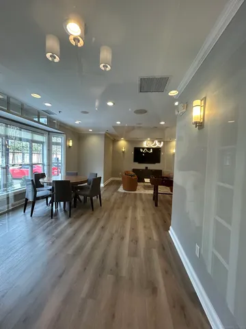 a lobby with furniture and a table