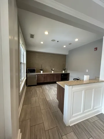 a view of kitchen with wooden floor
