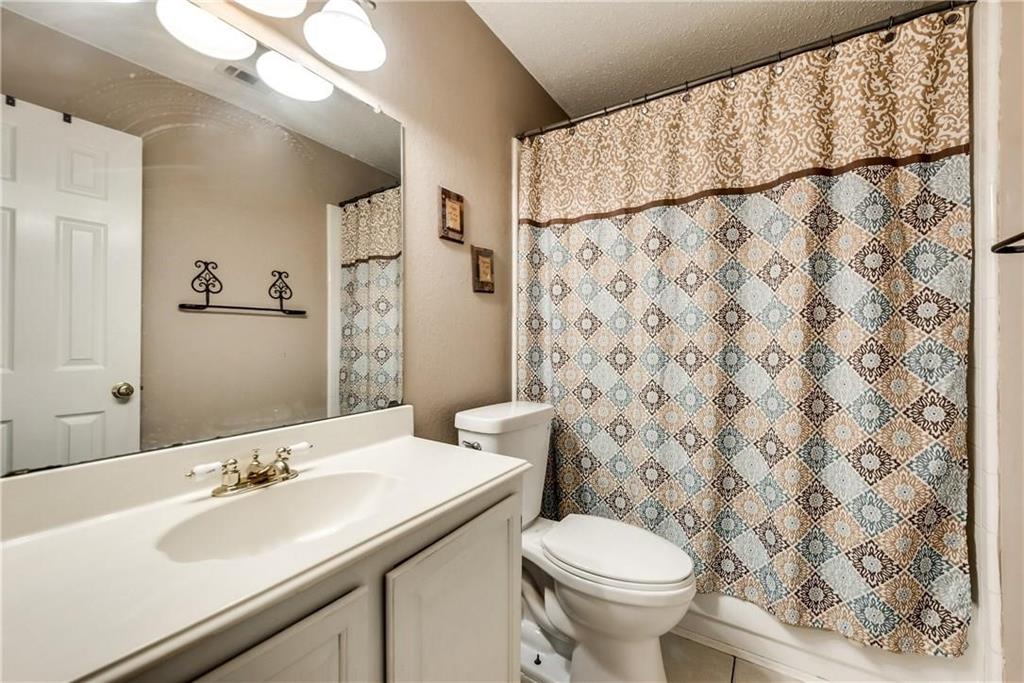 2114 Carnation Court Garland, TX 75040 - Photo 2 of 6 a bathroom with a sink and a toilet