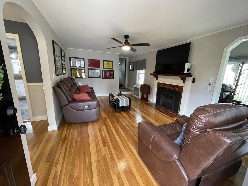 22 Westbrook Road Worcester, MA 01602 - Photo 11 of 39 a living room with furniture and a fireplace