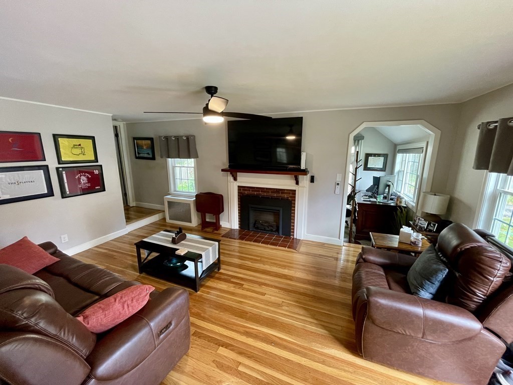 22 Westbrook Road Worcester, MA 01602 - Photo 12 of 39 a living room with furniture flat screen tv and a fireplace