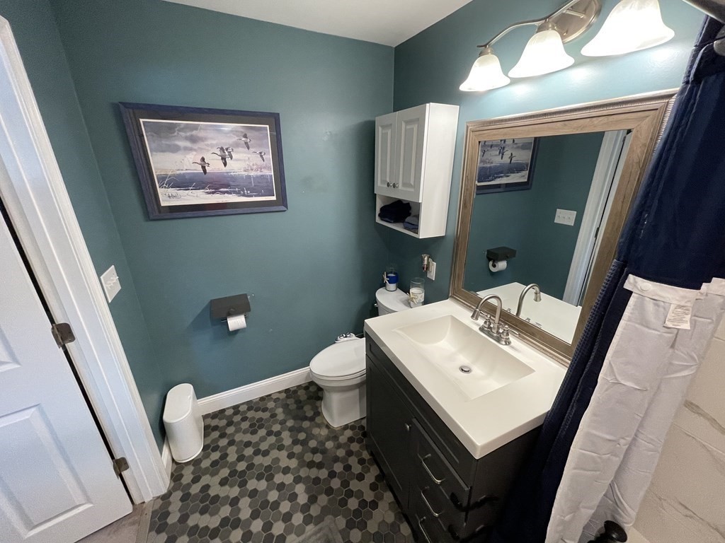 22 Westbrook Road Worcester, MA 01602 - Photo 29 of 39 a bathroom with a sink toilet and mirror