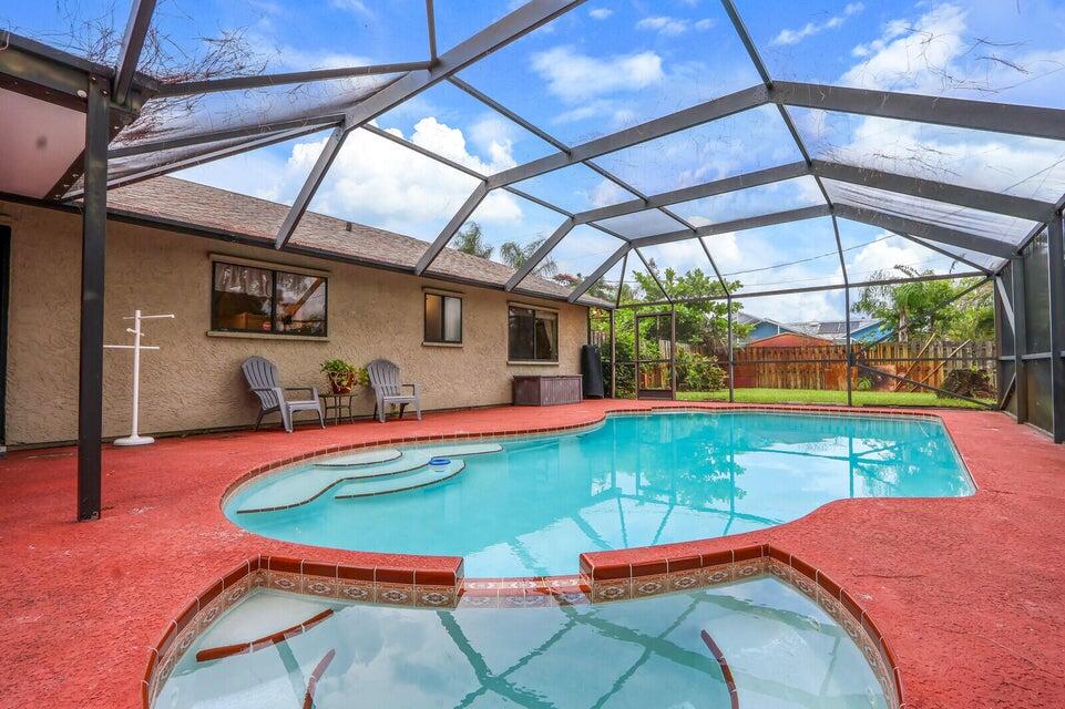 1258 Southeast Rickenbacker Terrace Port St. Lucie, FL 34952 - Photo 23 of 29 a room with pool table and windows